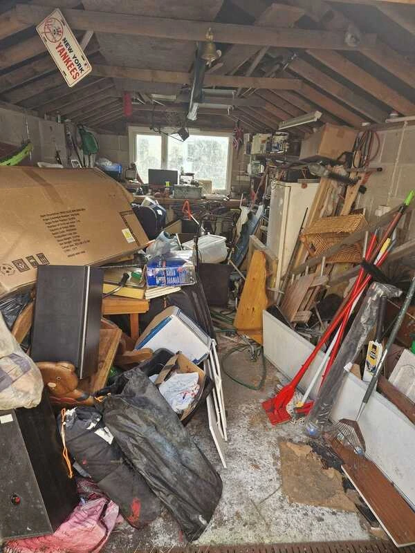 Before photo of a cluttered house or room needing professional clearance in Cornwall